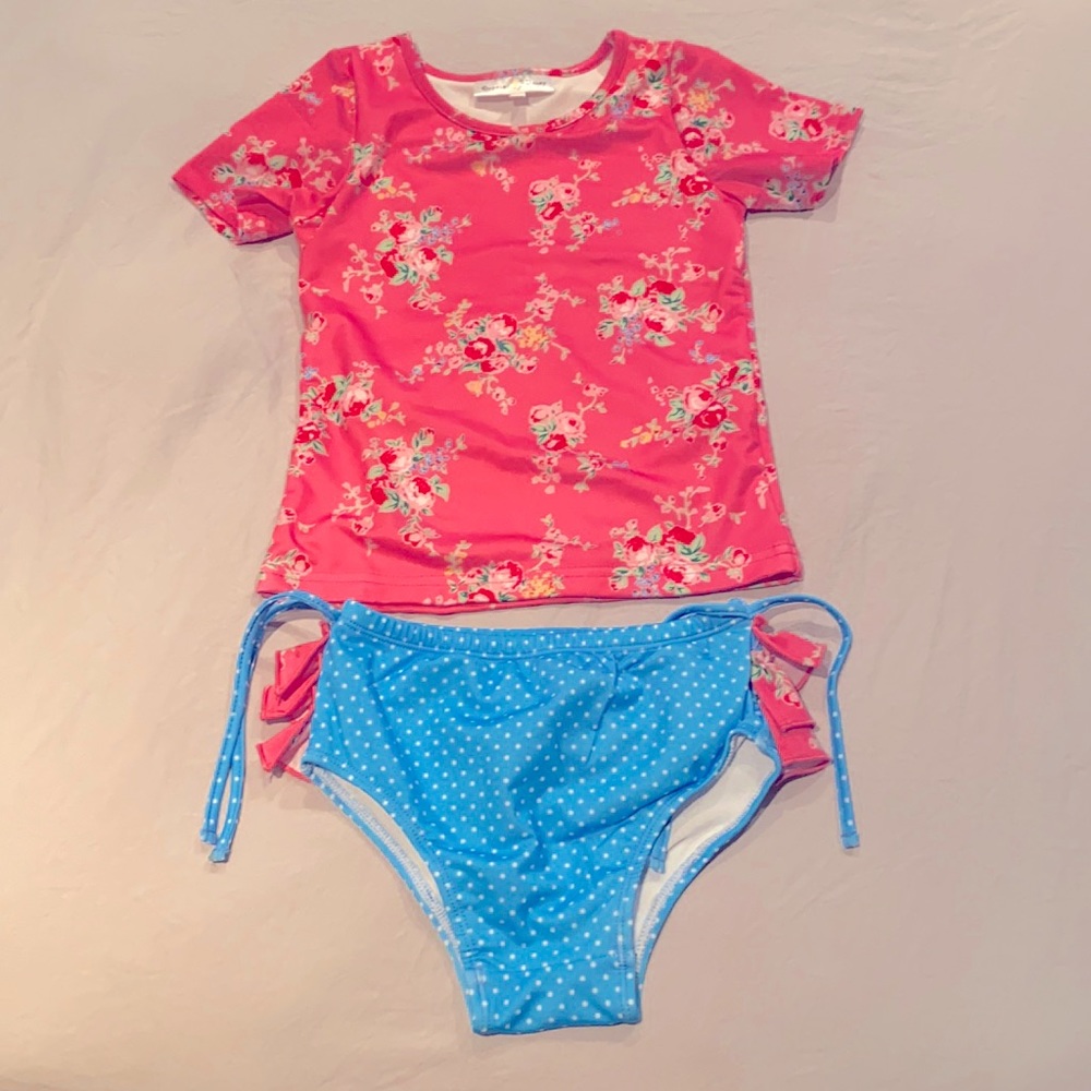 Oopsie Daisy  (Size 7) SPF 50! Brand New Blue and floral Vibrant pink tops.